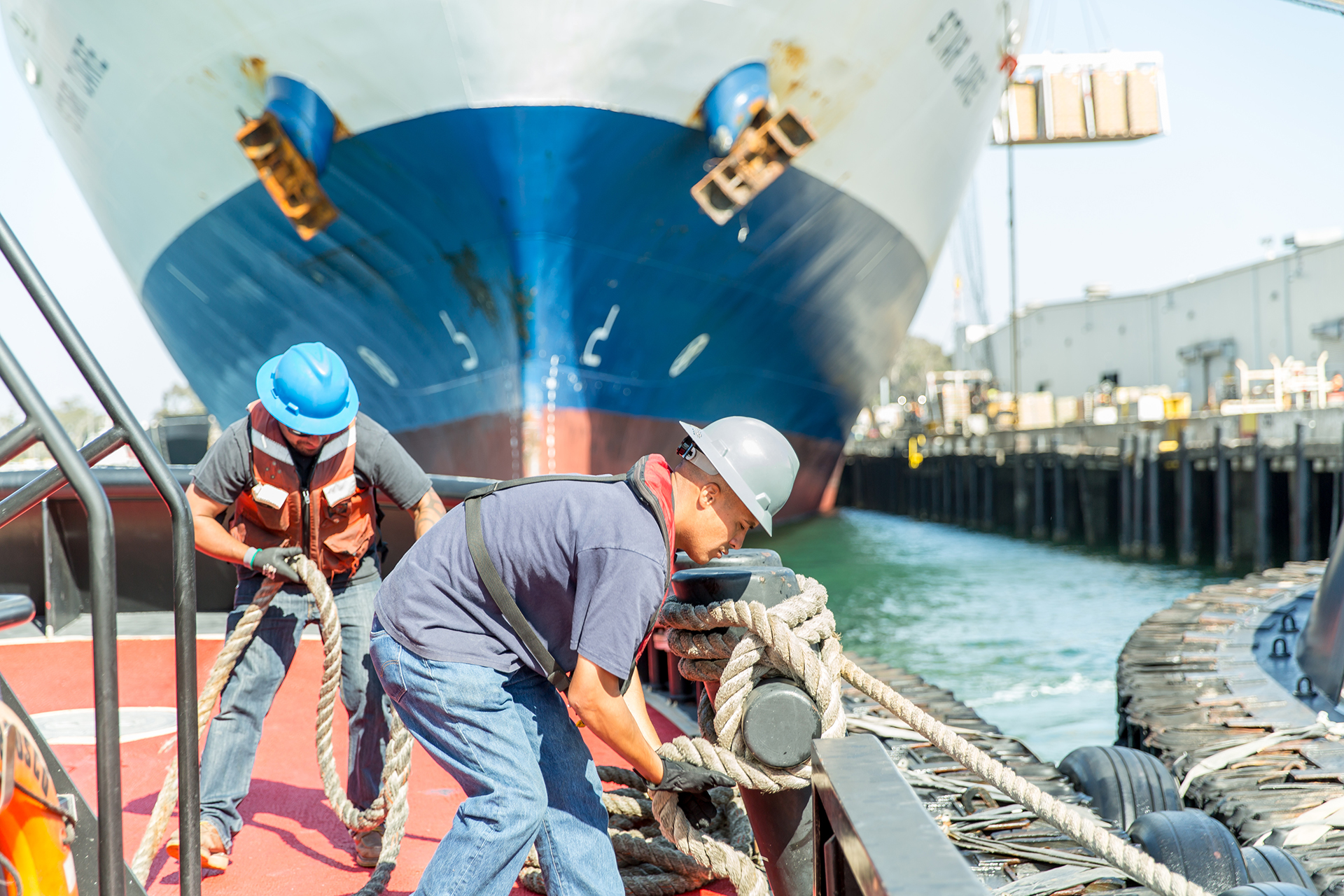 Two men working on a boat.